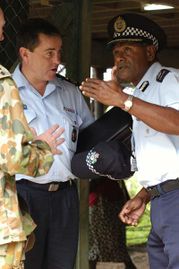 Commander of the Participating Police Force and newly sworn-in Deputy Commissioner of the Royal Solomon Islands Police Ben McDevitt consults with Superintendent Philip Idufo'oa, Provincial Police Commander, Malita Province.jpg