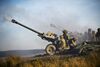 800px-Royal_Artillery_Firing_105mm_Light_Guns_MOD_45155621.jpg