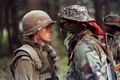 Patrick Cloutier, a 'Van Doo' perimeter sentry, and Anishinaabe Warrior Brad Larocque, a University of Saskatchewan economics student, stare each-other down during the Oka Crisis in Quebec, Canada. July-September 1990.jpg