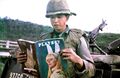 El ingeniero de combate Daniel Mouer leyendo un artículo. La revista fue enviada por su esposa, junto con un lote de galletas con chispas de chocolate. Vietnam 1966.jpg