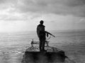 Грузинский доброволец стоит на берегу Черного моря. Очамчира. Абхазия. Грузино-абхазская война. 1992 г..jpg