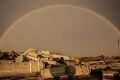 A rainbow above the debris of spent missiles in the village of Posad-Pokrovske in the Kherson region.jpg