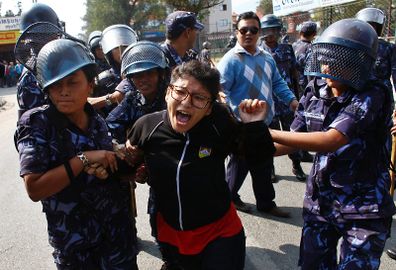 Nepal police detain a Tibetan who was shouting anti-China slogans in tribute to the Tibetans who died in the recent self-immolation, in Katmandu, Nepal, Tuesday, Nov. 1, 2011..jpg