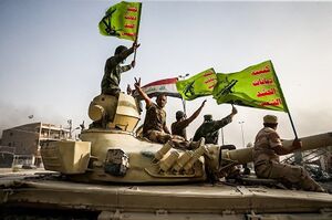 Raising flag of Iraq and Popular Mobilization Forces after defeating DAESH.jpg