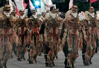 Puppets representing revolutionary hero Emiliano Zapata parade past as Mexico marks its 200th anniversary in Mexico City on September 15, 2010. .jpg
