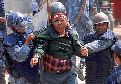 Nepalese police arrest a protester during a protest at the Chinese embassy in Kathmandu, Nepal 10 March 2008..jpg