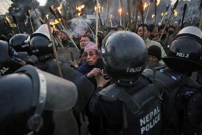 Nepalese police clash with demonstrators during a torch rally called by Opposition Alliance of 30 parties led by Communist Party of Nepal-Maoist, in Kathmandu, Nepal, Monday, Jan. 19, 2015.1.jpg