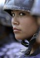 A Nepalese police woman stands guard as Maoist supporters protest against Nepalese President Ram Baran Yadav, in Katmandu, Nepal, Friday, May 8, 2009..jpg