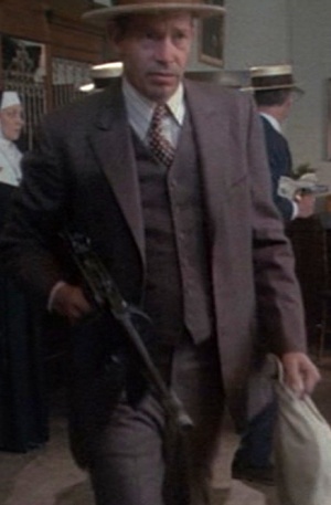 Warren Oates as John Dillinger, leaving a South Bend bank job in 1973’s Dillinger..jpg