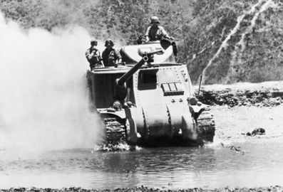 A British Lee tank crosses a river north of Imphal to meet the Japanese advance in Burma, 1944. IND3468.jpg