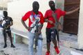 Masked members of "G9 and Family" gang stand guard during a press conference by their leader Barbecue in the Delmas 6 neighborhood of Port-au-Prince in Port-au-Prince, Haiti, Tuesday, March 5, 2024.jpg