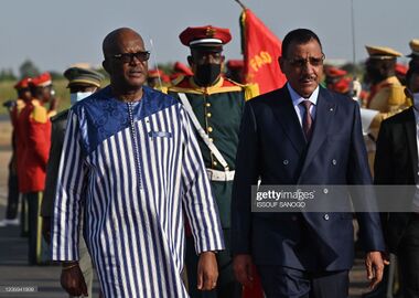 Niger's President Mohamed Bazoum (R) is welcomed by Burkina Faso's President Roch Marc Christian Kabore upon his arrival to Ouagadougou's airport on October 17, 2021.jpg