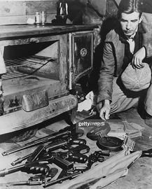 A few of the weapons used by American bank robber John Dillinger, abandoned in the Little Bohemia resort near Mercer, Wisconsin, after the outlaw escaped from a trap set by Federal agents,.jpg