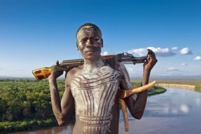 10434162-omo-walley-ethiopia-august-13-2011--man-of-the-karo-ethnic-group-posing-with-his-rifle.jpg