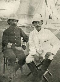 Emin Pasha meets Carl Peters at the German military station Mpapua in German East Africa on 19 June 1890.jpg