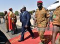 Burkina Faso's army-appointed leader Lieutenant-Colonel Isaac Zida (R) walks with president Macky Sall of Senegal (L) on November 11, 2014 at Ouagadougou airport in Burkina Faso.jpg