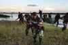 US_Navy_040626-N-1464F-019_Peruvian_Marines_conduct_a_beach_assault_during_UNITAS_45-04_field_training_along_the_Amazon_River.jpg
