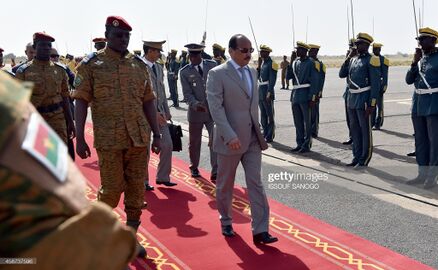 Burkina Faso's army officer installed as the head of the west African nation, Lieutenant-Colonel Isaac Zida (L), welcomes on November 10, 2014 at the Ouagadougou airport.jpg