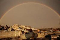 A rainbow above the debris of spent missiles in the village of Posad-Pokrovske in the Kherson region.jpg