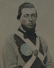 1024px-Private Peter S. Arthur of Company B, 11th Virginia Infantry Regiment, in uniform with secession badge and Virginia state seal breastplate LCCN2012646157.jpg
