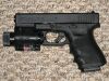 800px-Glock_Model_23_with_tactical_light_and_laser_sight..jpg