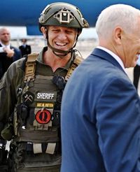 Pence posing with QAnon police crop.jpg