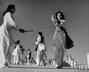 Pakistani members of the Sind Muslim Women's National Guard practicing combat w. bamboo lathi sticks traditionally used by the Indian police 1947 - 6.jpg