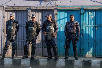 Nepali police forces stand in front of closed businesses in the Maharajgunj neighborhood during the opposition bandh (protest) that shuttered the city on January 20, 2015 in Kathmandu, Nepal..jpg