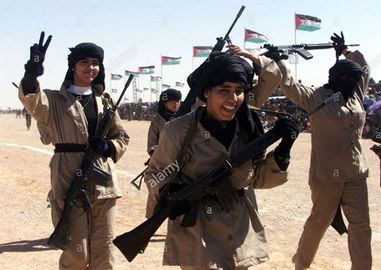 Women-soldiers-of-the-polisario-front-parade-during-celebrations-for-the-25th-anniversary-of-the-polisario-fronts-independence-movement-for-control-of-western-sahara-from-morocco-february-27-2001-in-el-ayoun-refugee-c.jpg