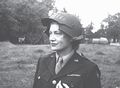 Lee Miller with specially fitted helmet, the visor facilitates the use of a camera, Normandy, 1944.jpg