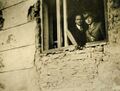 Пошкоджена під час нападу угорських терористів будівля пошти. У вікні невідомий та І. Рогач, 1938.jpg