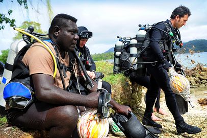 (L-R) Royal Solomon Islands Police Force (RSIPF) Sergeant John Mirikale, Royal Australian Navy (RAN) Leading Seaman Clearance Diver John Spindler and Able Seaman Clearance Diver Rob Panetta prepare to conduct Explosive.jpg