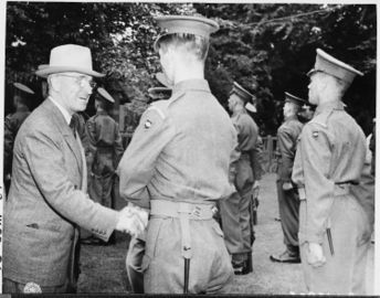 President Harry S. Truman shakes hands with Guardsman Campbell of the Second Battalian, Scot's Guard of Honor, while... - NARA - 198805.jpg